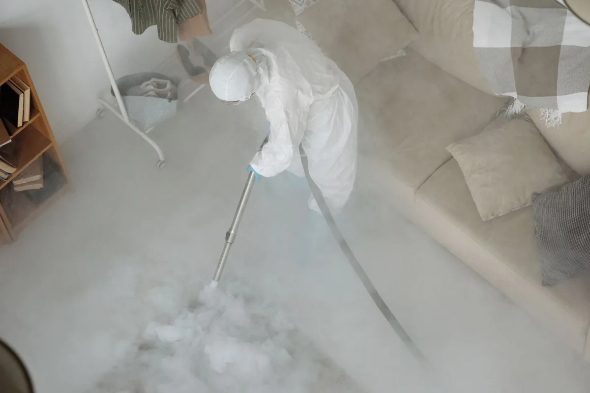 Biohazard cleanup technician in protective equipment, Redmond, WA